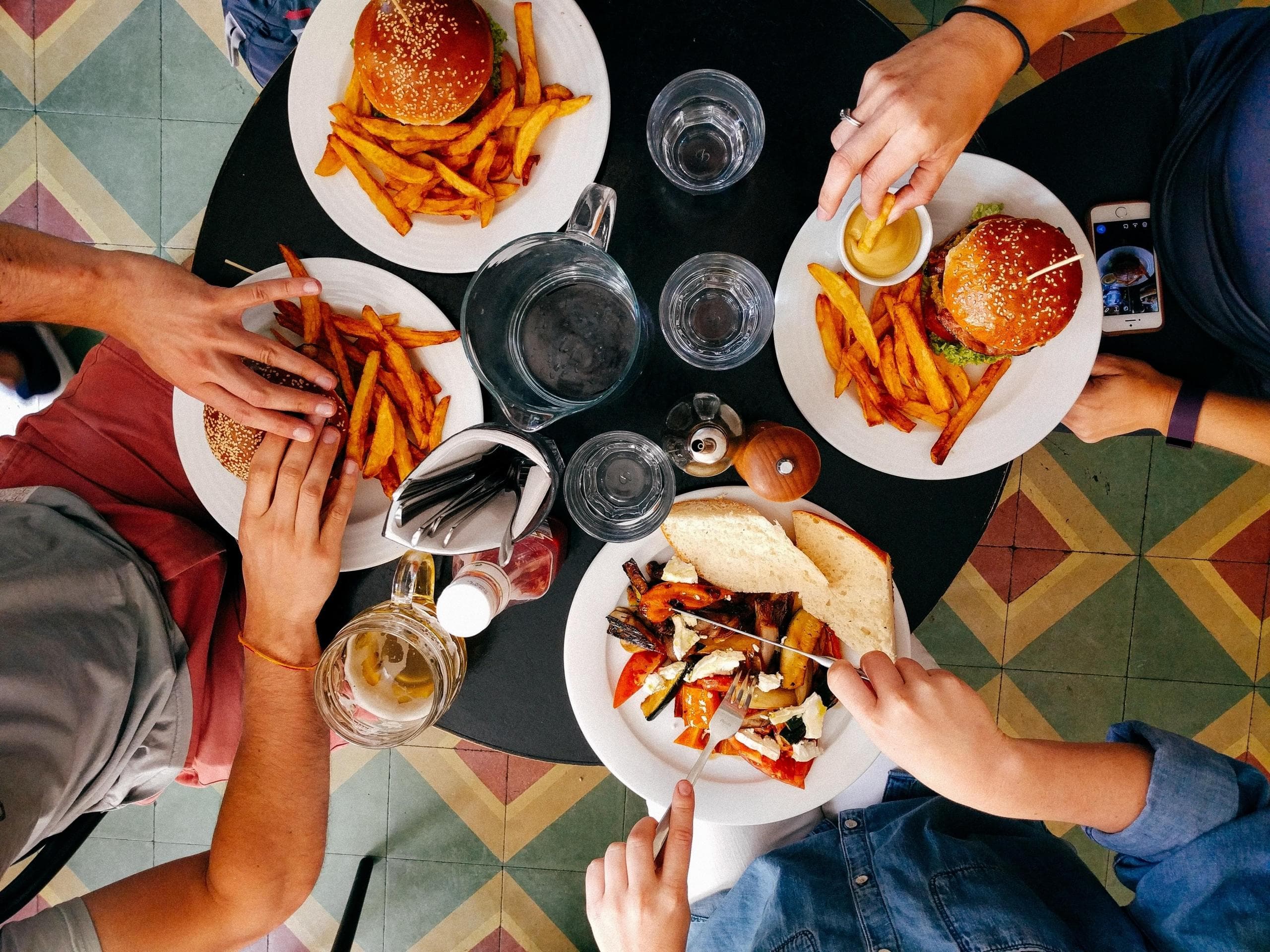 Friends sharing food at a local restaurant
