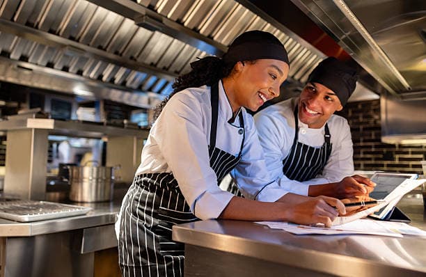 Restaurant chefs working together in their kitchen