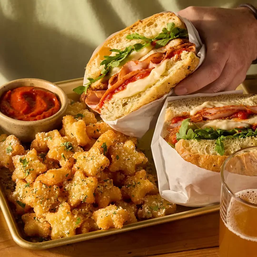 Toasted sandwiches served with crispy potatoes
